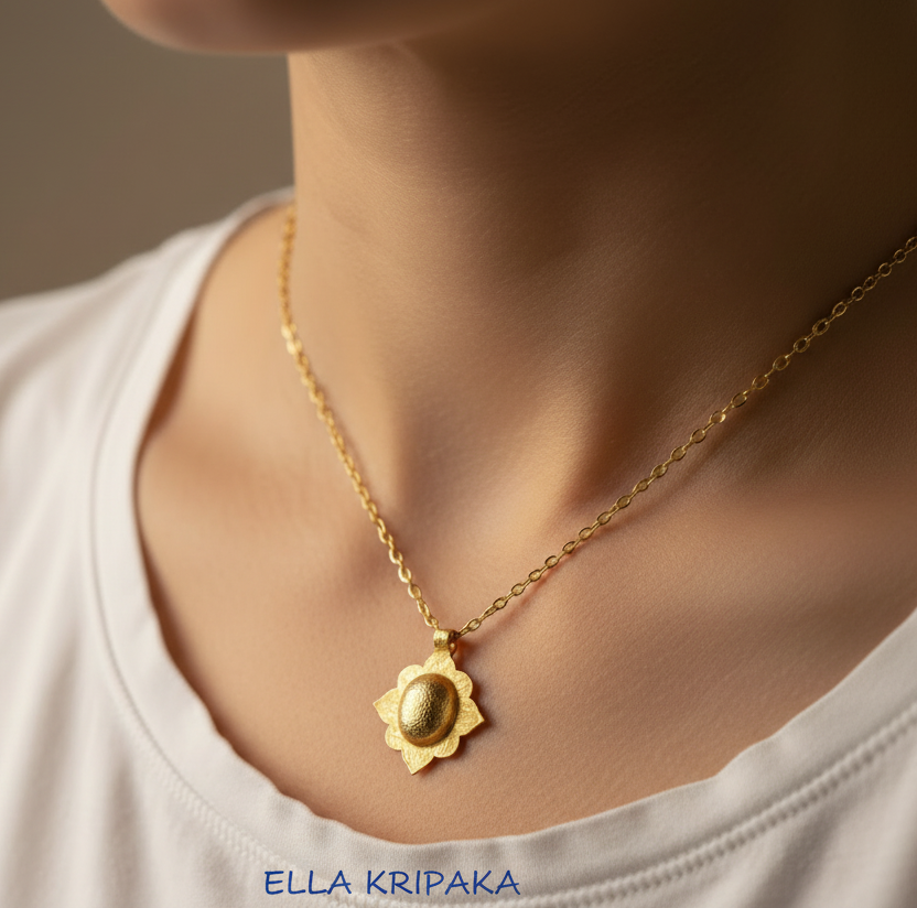 24k 9999 gold hammered Byzantine dome pendant with shiny forged gold textures is on chain wearing on model in white t-shirt, artist's name 'Ella Kripaka'