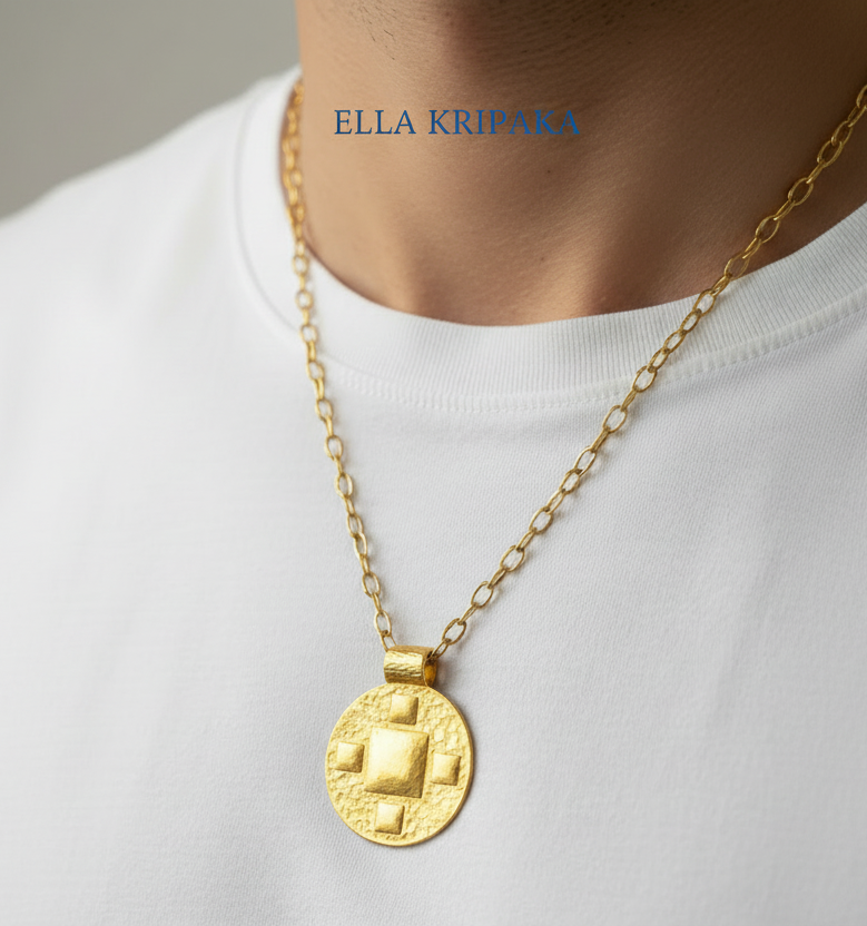 24k 9999 gold hammered byzantine pendant on chain wearing on man in a white t-shirt, branded 'Ella Kripaka'