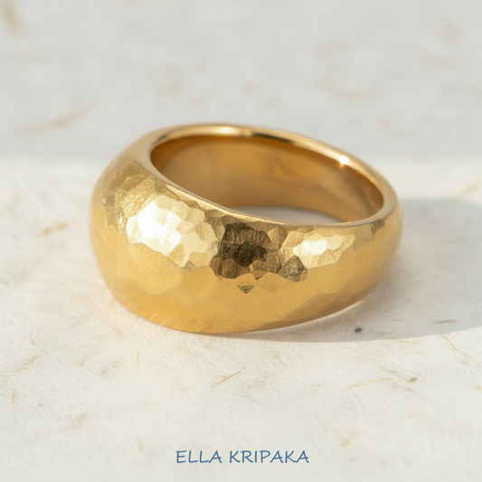 Hammered 24k 9999 Gold ring convex signet Ancient Rome style on white paper surface, artist-jeweler's name 'Ella Kripaka' branding