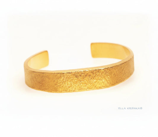 Hammered 24k 9999 gold bracelet cuff Ancient Rome style on a white background, branding artist-jeweler name 'Ella Kripaka'