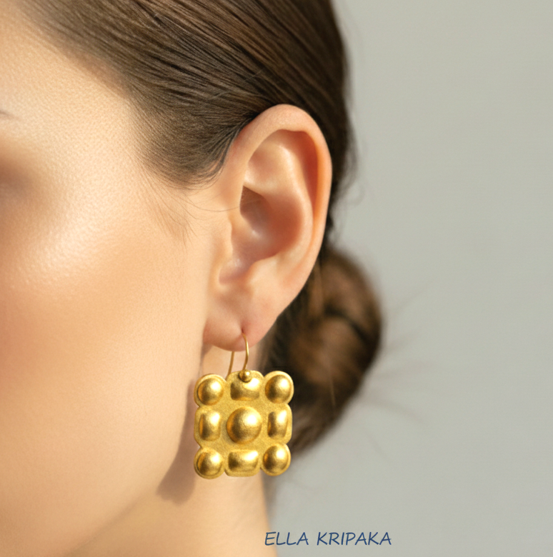 Hammered 24k 9999 Gold Byzantine square earrings wearing by a person, and artist's name 'Ella Kripaka' branding