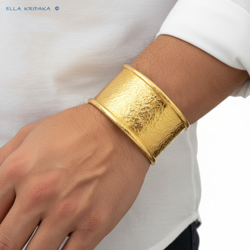 Hammered 24k 9999 gold bracelet large cuff Ancient Rome style with thick borders on a man's wrist, branding artist-jeweler name 'Ella Kripaka'