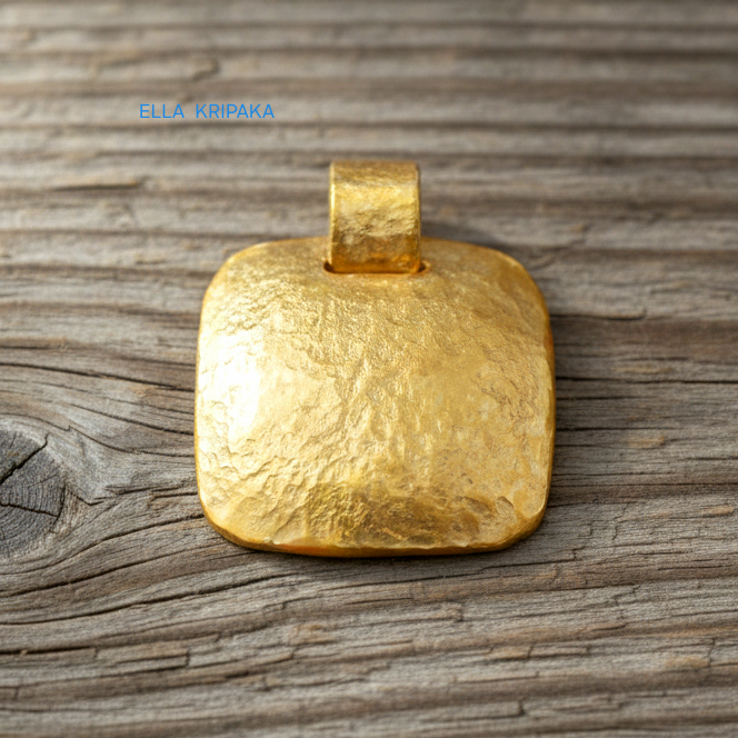 Hammered 24k gold textured convex square pendant on rustic wooden surface with 'Ella Kripaka' branding