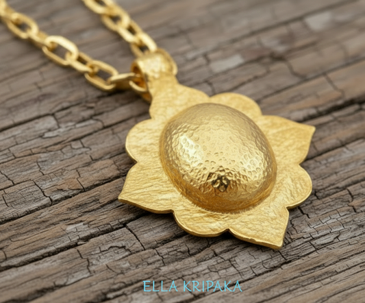 24k 9999 gold hammered Byzantine dome pendant on chain and with shiny forged gold textures is on a old rustic wooden surface, artist's name 'Ella Kripaka'
