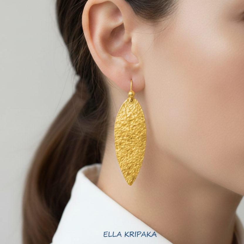 Hammered 24k 9999 Gold Byzantine leaf earrings wearing by a person, and artist's name 'Ella Kripaka' branding