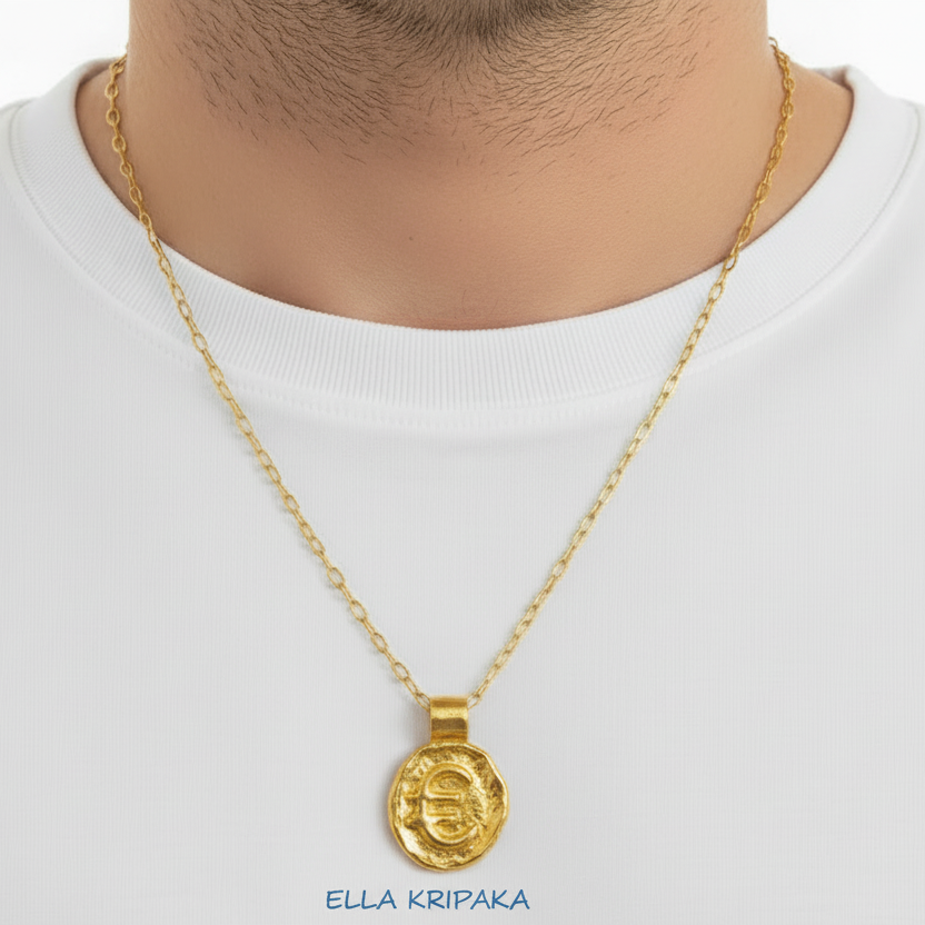 Hammered 24k 9999 Gold organic uneven pendant with convex 'Euro Sign' is with chain wearing on  man in white t-shirt, artist's name 'Ella Kripaka' 