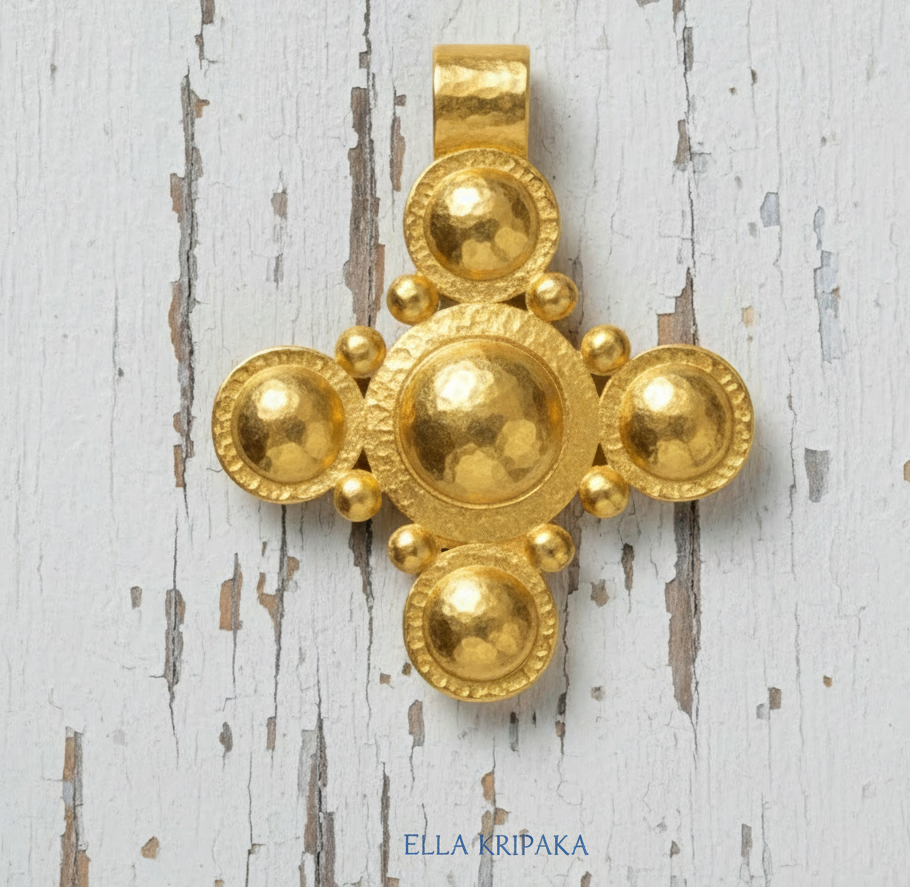 24k 9999 gold hammered Byzantine cross pendant with shiny forged gold textures is on a old white old wooden surface, artist's name 'Ella Kripaka'