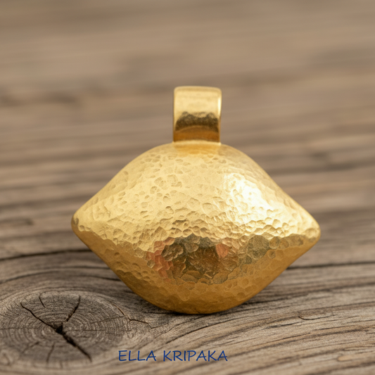 24k 9999 gold hammered Byzantine dome pendant with shiny forged gold textures is on a old wooden surface, artist's name 'Ella Kripaka'