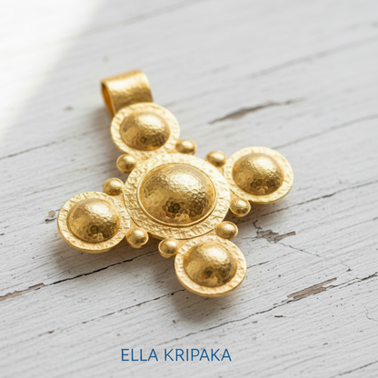24k 9999 gold hammered Byzantine cross pendant with shiny forged gold textures is on a old white old wooden surface, artist's name 'Ella Kripaka'