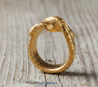 Twisted hammered 24k 9999 Gold ring signet with textured gold on a wooden surface, artist-jeweler's name 'Ella Kripaka' is written on picture