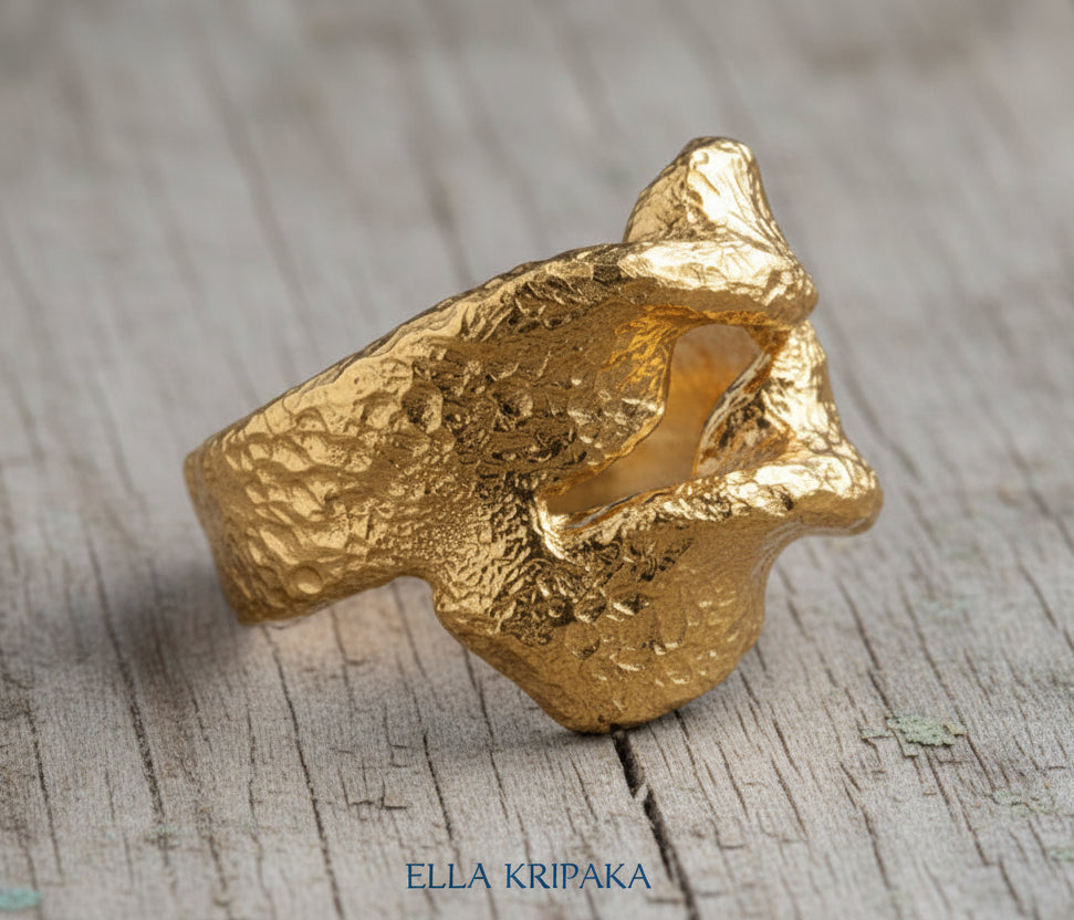 Twisted hammered 24k 9999 Gold ring signet with textured gold on a wooden surface, artist-jeweler's name 'Ella Kripaka' is written on picture