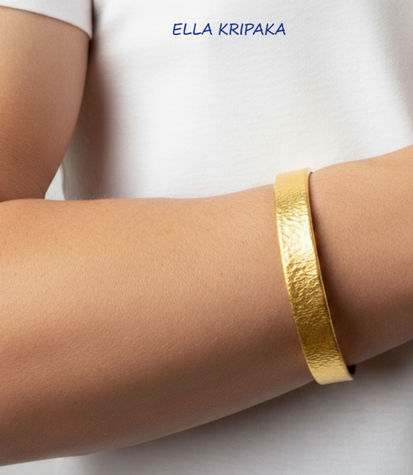 Hammered 24k gold 9999 gold bangle thick bracelet Ancient Rome style on person's wrist, forged 24k gold jewelry, artist-jeweler 'Ella Kripaka'