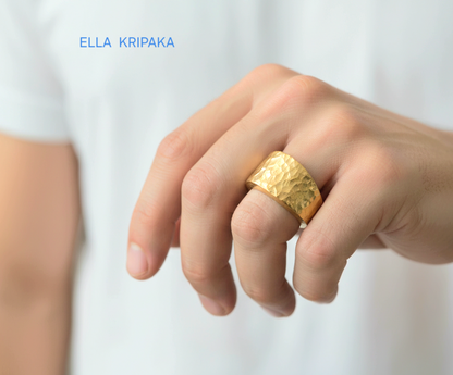 Hammered 24k 9999 Gold ring thick signet and Ancient Rome style and with forged textured gold worn on model's finger and on a white plain background, artist-jeweler's name 'Ella Kripaka' branding