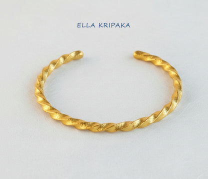 Viking Twisted Hammered 24k 9999 gold cuff thick bracelet on a white background, artist-jeweler name 'Ella Kripaka' branding
