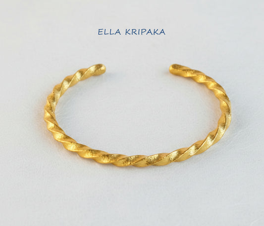 Viking Twisted Hammered 24k 9999 gold cuff thick bracelet on a white background, artist-jeweler name 'Ella Kripaka' branding