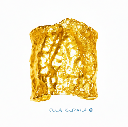Organic 24k gold hammered wavy cuff large bracelet with thick uneven textured borders is on white background, branding artist-jeweler name 'Ella Kripaka'