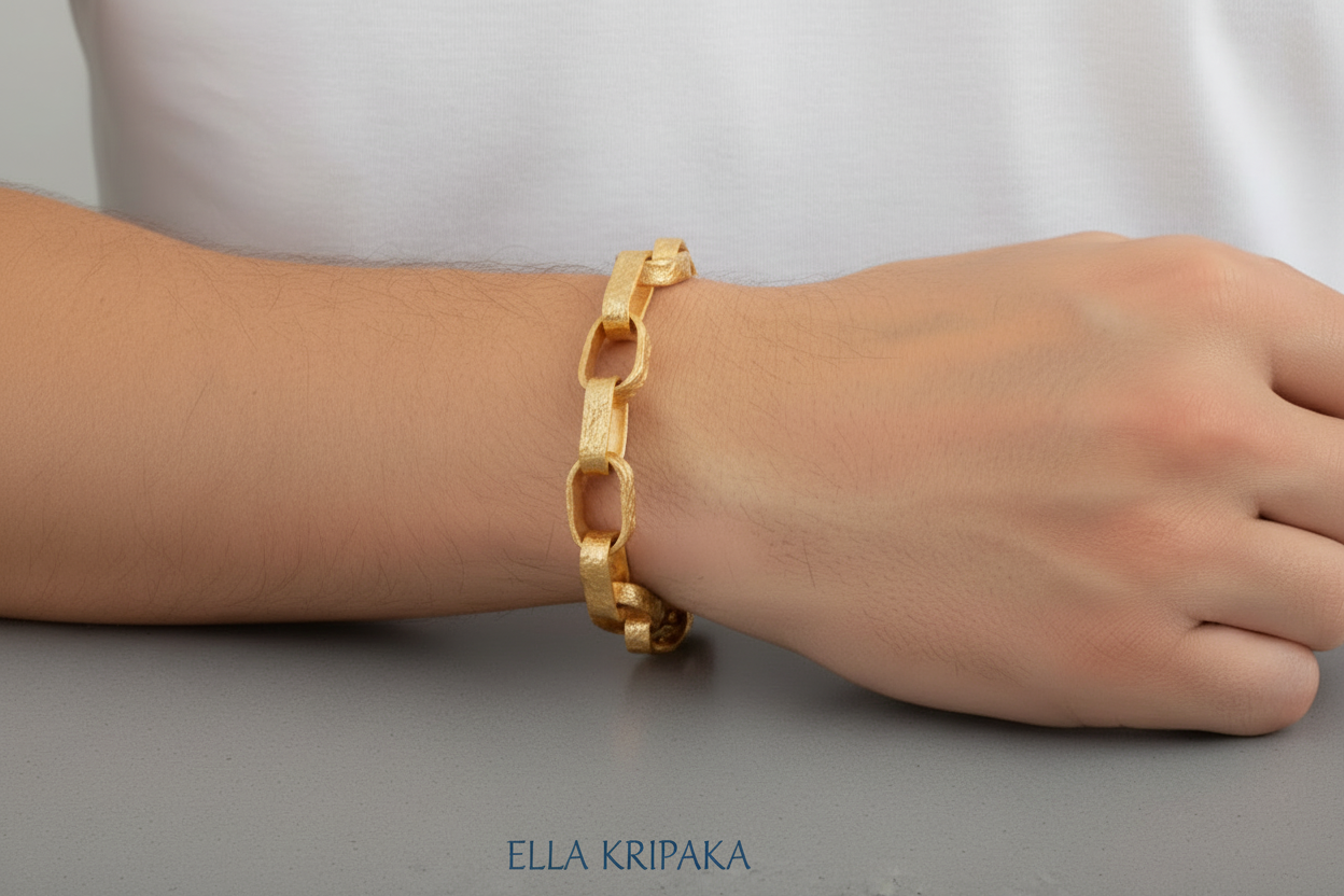 Hammered 24k 9999 gold chain thick bracelet  Ancient Rome style worn by a man on wrist and on a neutral background, artist-jeweler name 'Ella Kripaka' branding