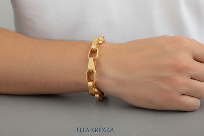 Hammered 24k 9999 gold chain thick bracelet  Ancient Rome style worn by a man on wrist and on a neutral background, artist-jeweler name 'Ella Kripaka' branding