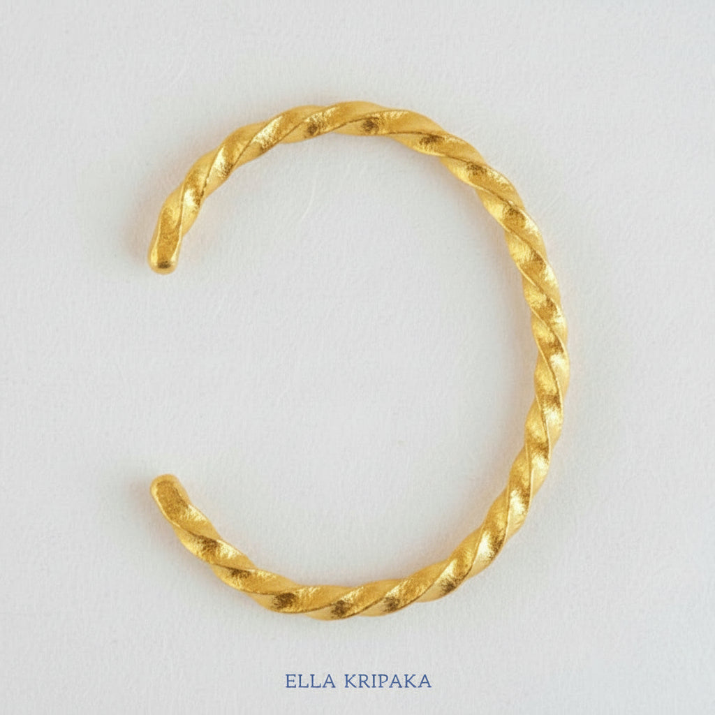 Viking Twisted Hammered 24k 9999 gold cuff thick bracelet on a white background, artist-jeweler name 'Ella Kripaka' branding