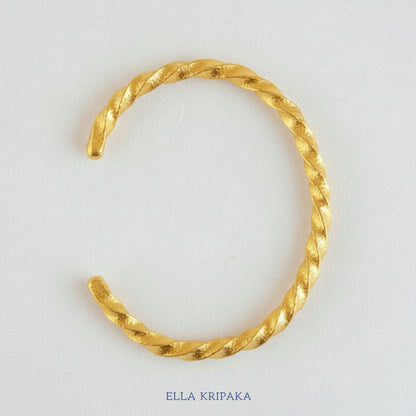 Viking Twisted Hammered 24k 9999 gold cuff thick bracelet on a white background, artist-jeweler name 'Ella Kripaka' branding