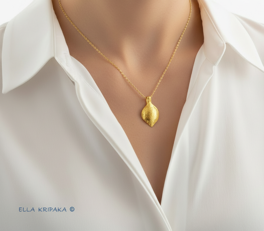 Hammered 24k 9999 Gold Byzantine Pendant wearing on woman's neck with white shirt, forged pure 24k gold jewelry, artist-jeweler's name 'Ella Kripaka'