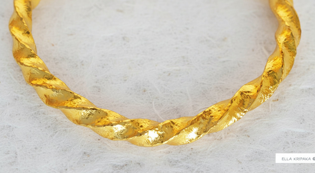 Viking Twisted Hammered 24k 9999 gold cuff thick bracelet on a white background, artist-jeweler name 'Ella Kripaka' branding