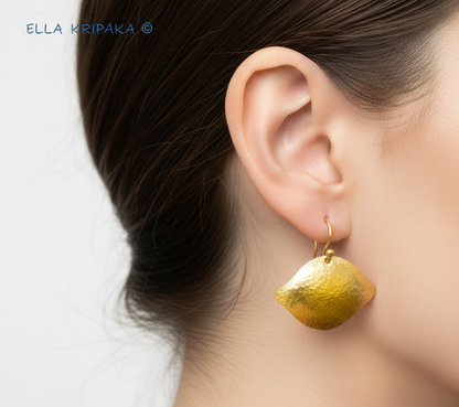 Solid 24k 9999 gold hammered Byzantine fome earrings with hook clasp and shiny forged 24k gold textures wearing on woman's ear, name 'ELLA KRIPAKA'
