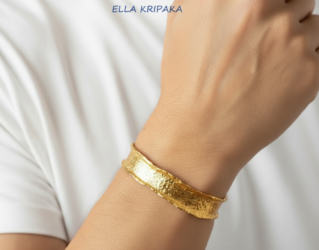 Hammered organic 24k 9999 gold uneven bracelet cuff  on a man's wrist, branding artist-jeweler name 'Ella Kripaka'
