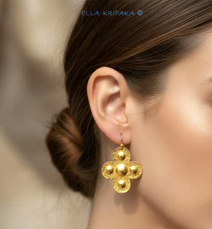 Hammered 24k 9999 Gold Byzantine cross earrings worn by a woman on a neutral background with 'Ella Kripaka' branding