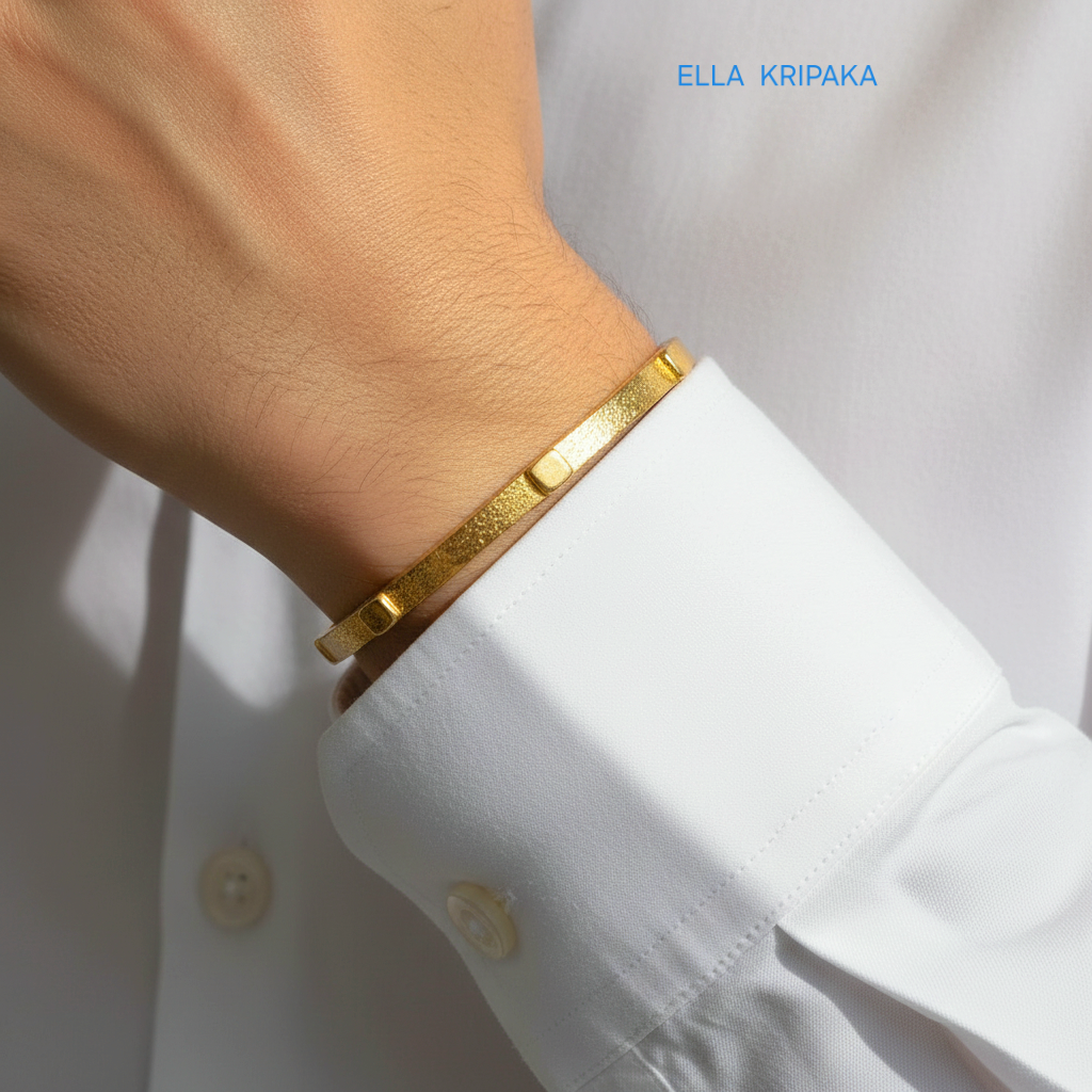 24k gold hammered cuff textured bracelet with thick squares is worn by a man on wrist and on white shirt background, artist 'Ella Kripaka' branding