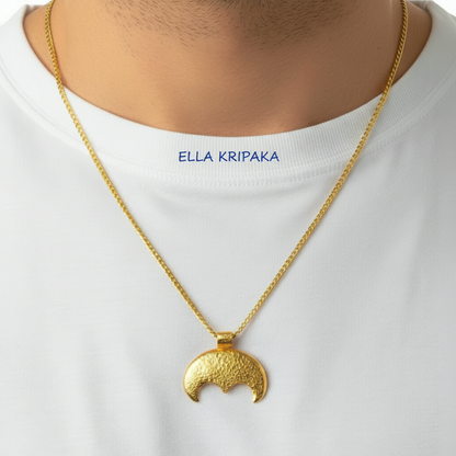Hammered 24k gold convex Moon pendant with chain worn by a person and with a white blurred background with 'Ella Kripaka' branding