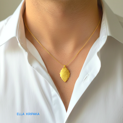 Hammered 24k gold Byzantine pendant with chain worn by a person and with a white shirt background with 'Ella Kripaka' branding