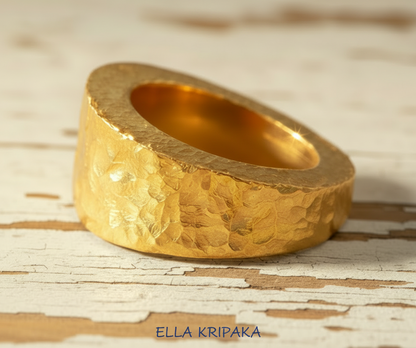 Hammered 24k 9999 Gold ring thick signet Ancient Rome style on old wooden surface, artist-jeweler's name 'Ella Kripaka' branding