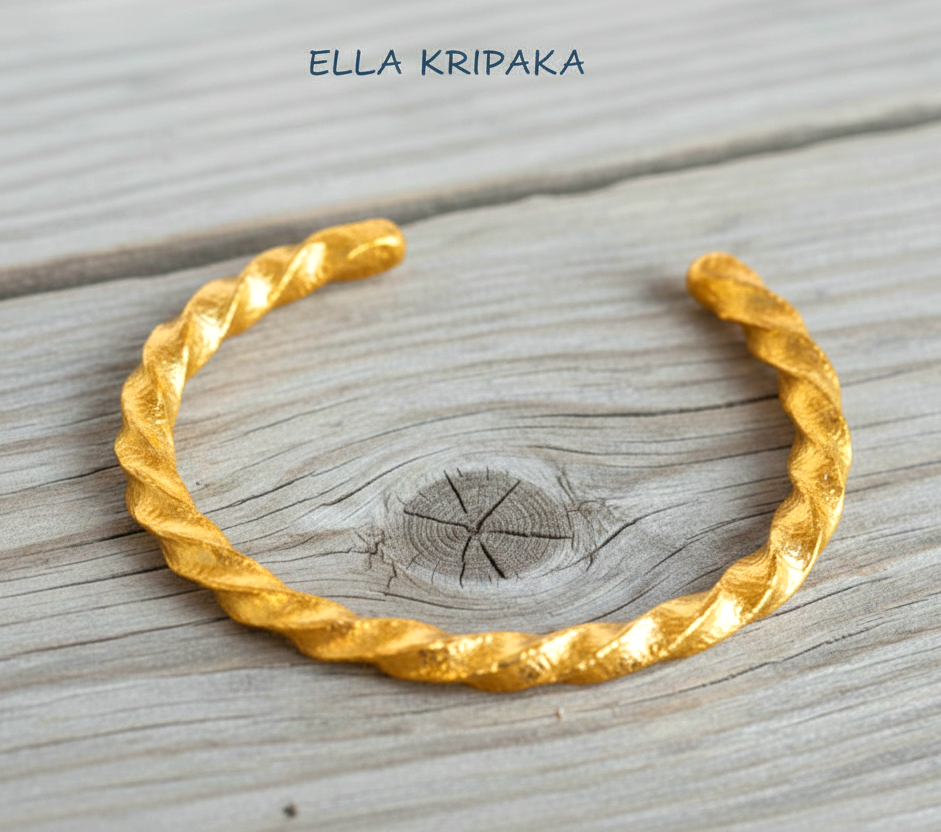 Viking twisted hammered 24k 9999 Gold thick cuff bracelet on a old wooden background, and with 'Ella Kripaka' branding