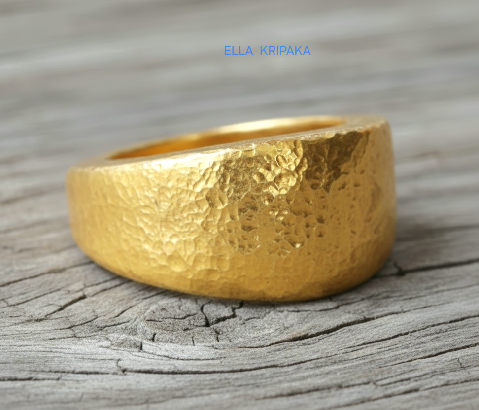Hammered 24k Gold 9999 gold signet thick ring Ancient Rome style with textured gold on old wooden background, branded 'Ella Kripaka'