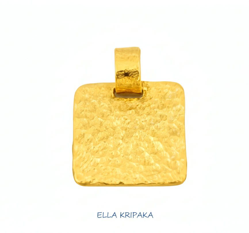 Hammered 24k gold, pure 9999 gold square pendant with shiny forged gold textures on white paper surface, artist-jeweler 'Ella Kripaka' branding