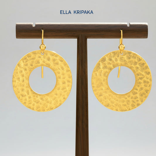 24k 9999 gold hammered hoop earrings Ancient Rome style shiny gold textures are on wooden stand and on grey background, artist-jeweler's name 'Ella Kripaka'