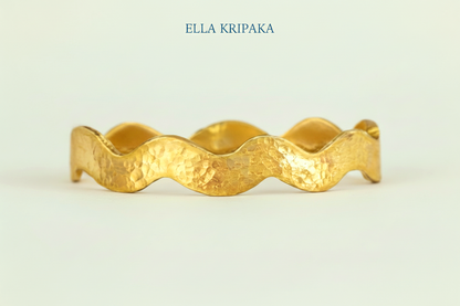 Wavy Hammered 24k 9999 Gold bangle bracelet on white surface, artist's name 'Ella Kripaka' branding