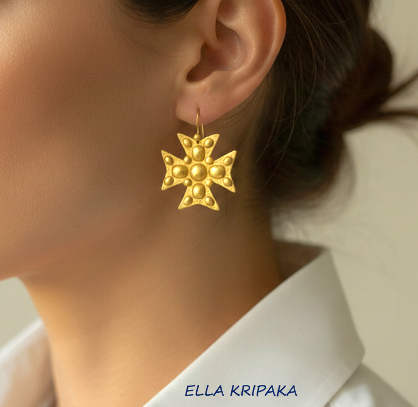 Hammered 24k 9999 Gold Byzantine cross earrings wearing by a person, and artist's name 'Ella Kripaka' branding