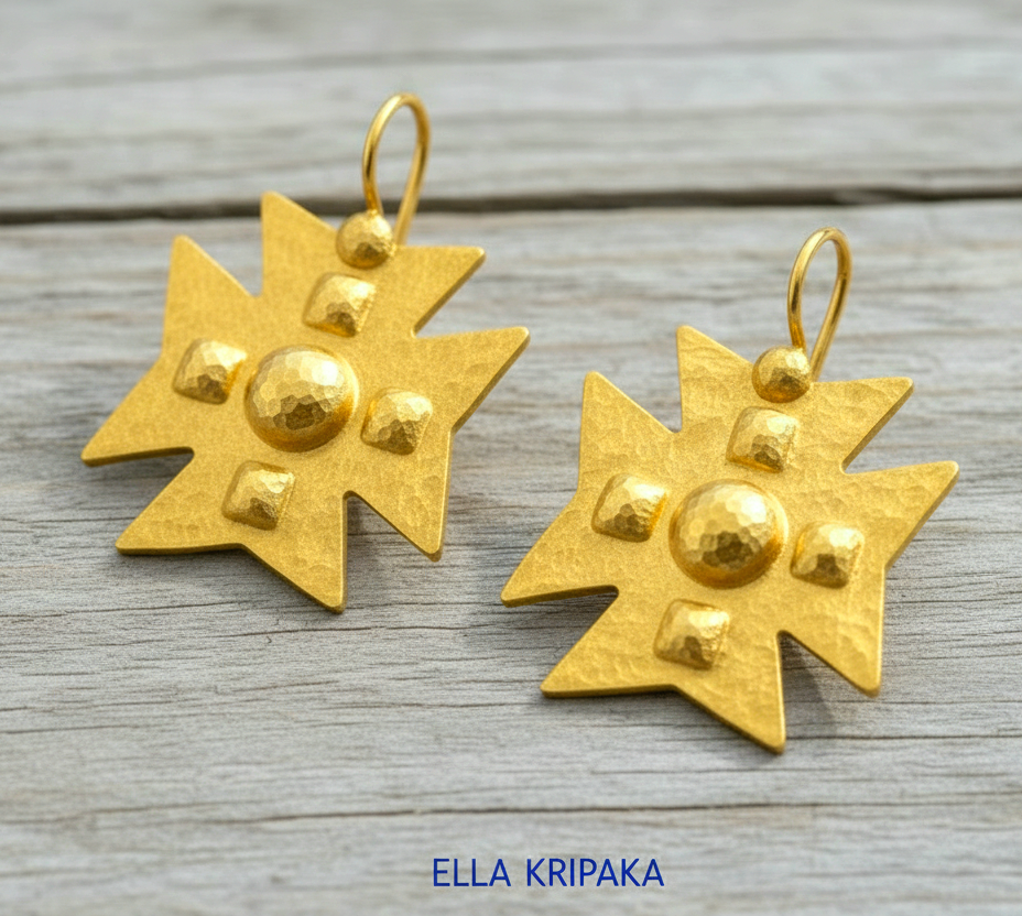 Hammered 24k 9999 Gold Byzantine cross earrings on a old wooden background with 'Ella Kripaka' branding