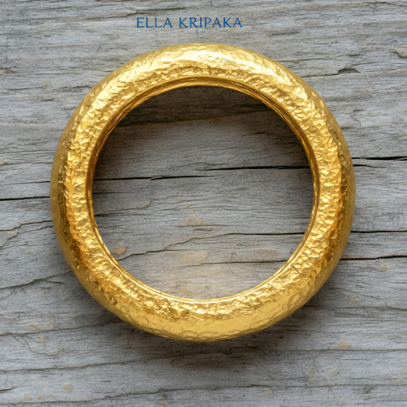 Hammered 24k Gold 9999 gold Ancient Rome  thick ring with textured forged gold on a grey old wooden background, branded 'Ella Kripaka'