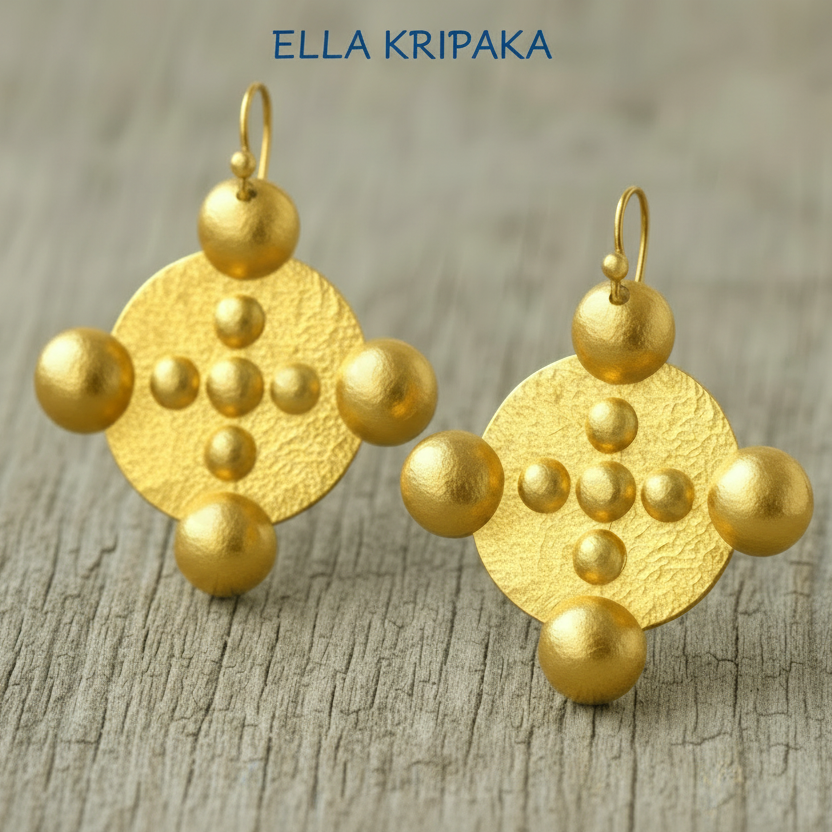 Hammered 24k gold, pure 9999 gold Byzantine convex rounds earrings with shiny forged gold textures on old wooden surface, artist-jeweler 'Ella Kripaka' branding
