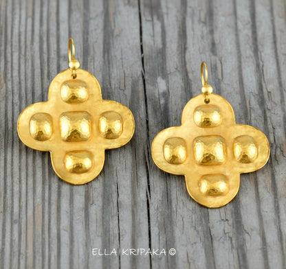 Hammered 24k 9999 Gold Byzantine cross earrings on a old wooden background with 'Ella Kripaka' branding