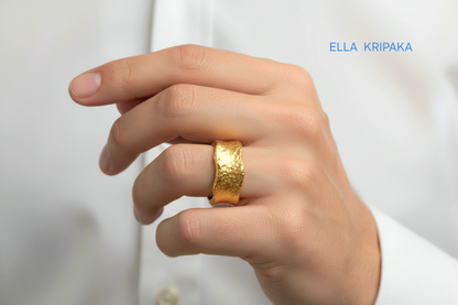 Hammered organic 24k gold 9999 gold wavy thick ring band with textured gold worn on model's finger and on a white background, branded 'Ella Kripaka'