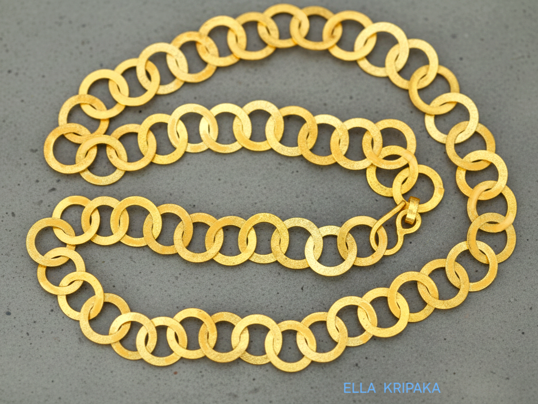 22k gold hammered chain necklace with thick hook clasp on a grey background, artist-jeweler's name 'Ella Kripaka' branding