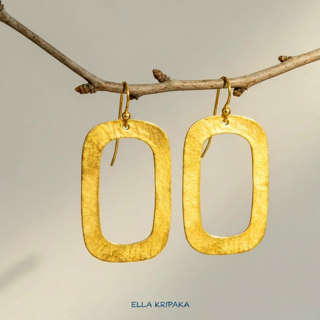 24k gold hammered textured rectangular hoops earrings hanging on a branch and on light grey background,  arist-jeweler 'Ella Kripaka' branding