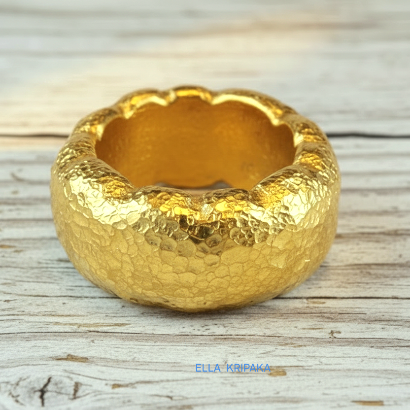 Organic hammered 24k gold 9999 Gold textured wavy thick ring on a wooden surface with 'ELLA KRIPAKA' branding