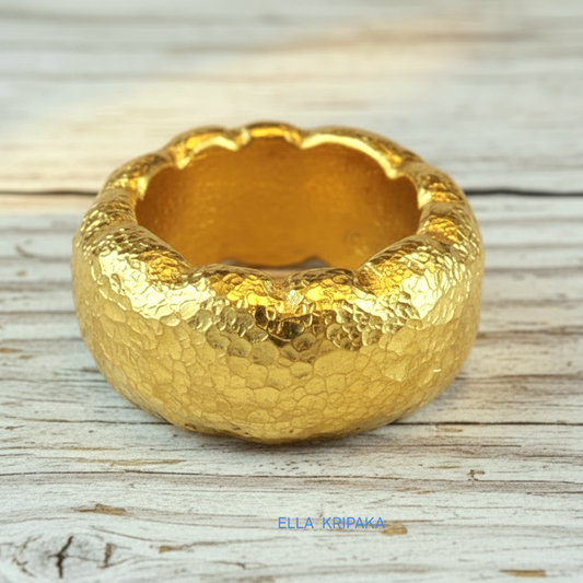 Organic hammered 24k gold 9999 Gold textured wavy thick ring on a wooden surface with 'ELLA KRIPAKA' branding