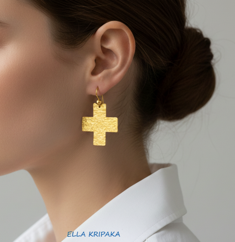 Hammered 24k 9999 Gold Byzantine cross earrings wearing by a person, and artist's name 'Ella Kripaka' branding
