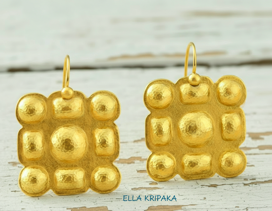Hammered 24k gold Byzantine square earrings with shiny forged gold textures on old wooden surface, artist-jeweler 'Ella Kripaka' branding